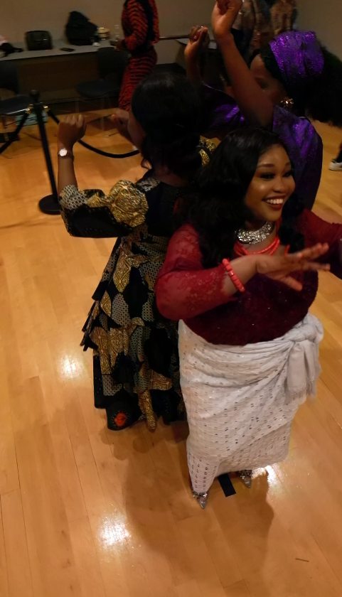 Guests in colorful formal clothing moving together during a drone-powered 360 experience